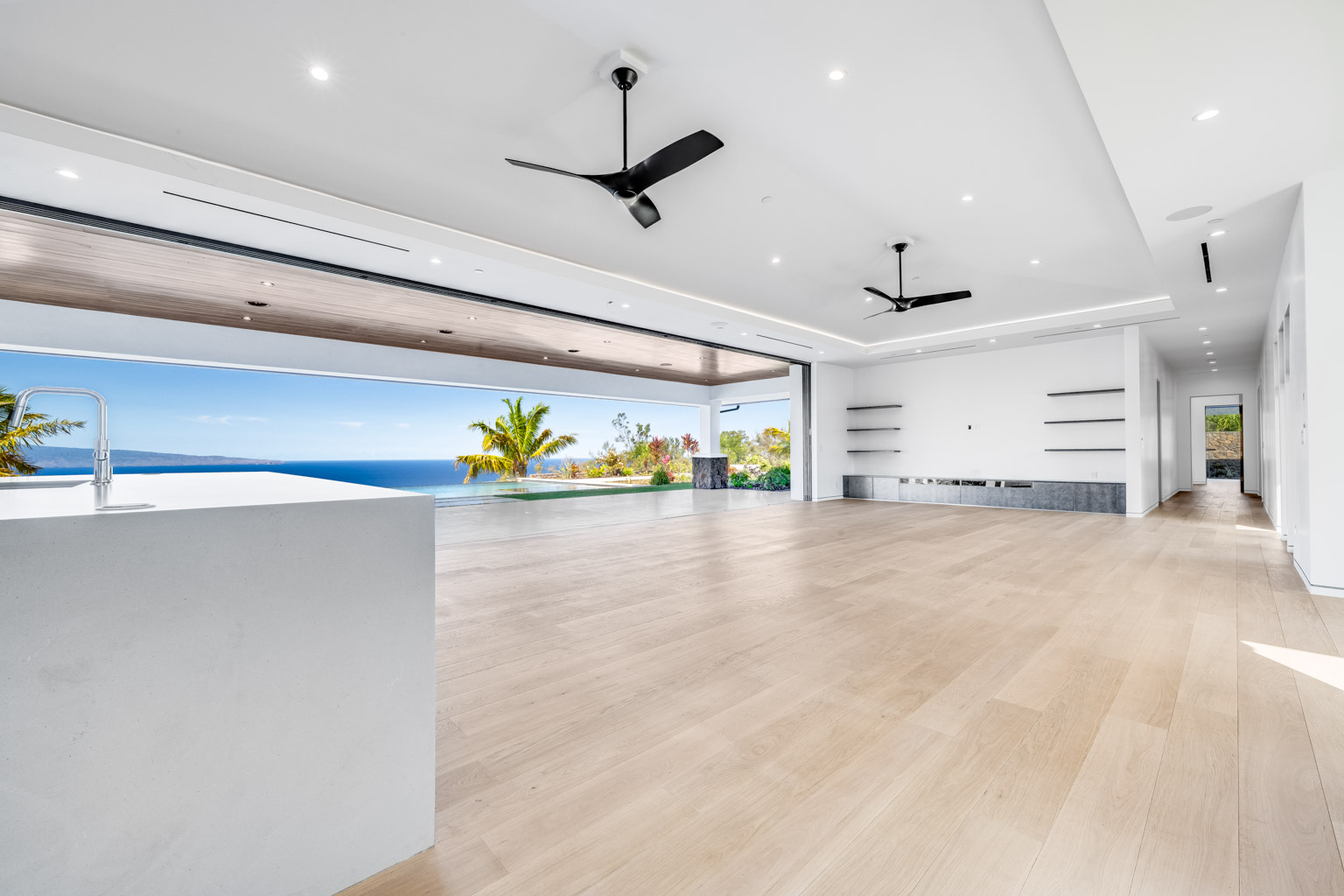 Great Room at 710 Mahana Ridge Street opening to the ocean view